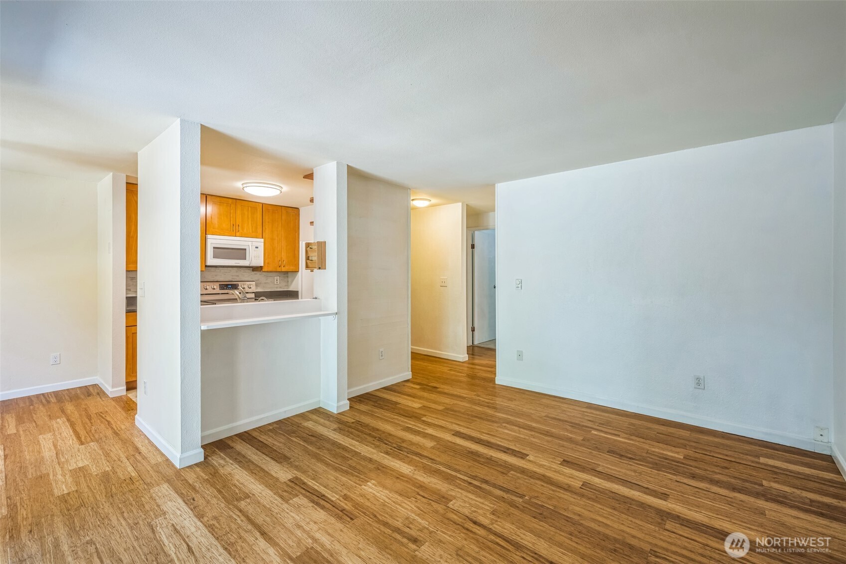 7311 224th Street Southwest, Unit C5 Edmonds, WA 98026 - Photo 7 of 28 a view of empty room with wooden floor