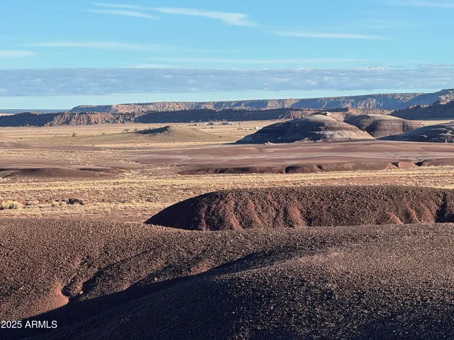 a view of water heater and a floor with fire pit
