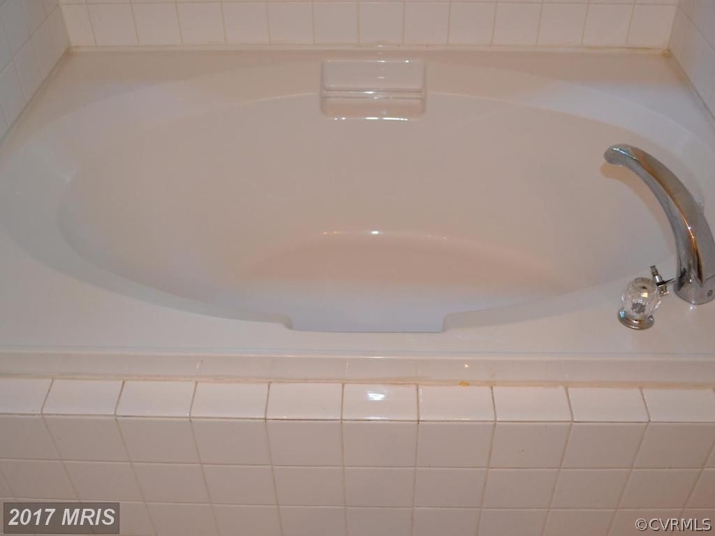 255 Cedar Ridge Drive Ruther Glen, VA 22546 - Photo 18 of 25 a bathroom with a shower