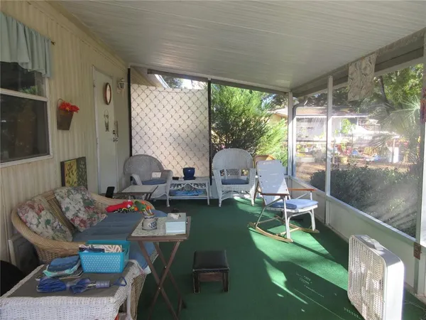 a kitchen with stainless steel appliances granite countertop a refrigerator a stove a microwave oven with a dining table and chairs