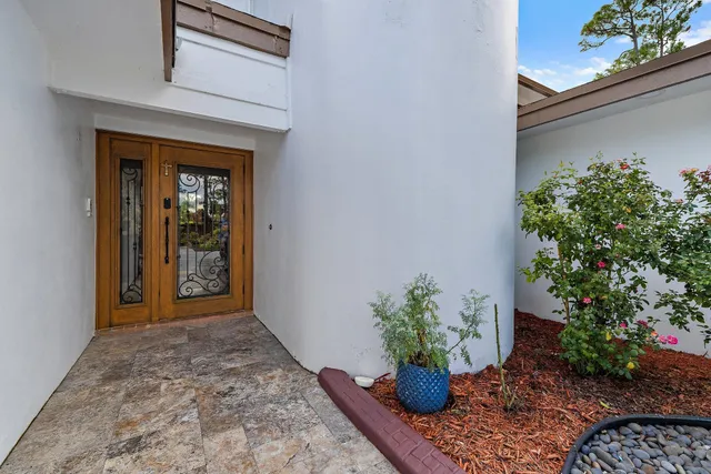 a living room with furniture fireplace and dining table