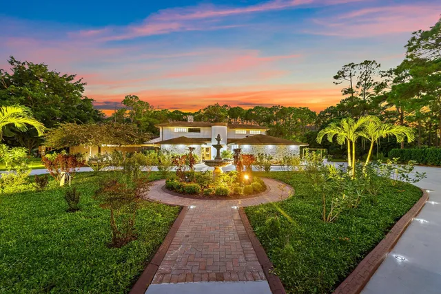 a view of a lake with houses in the back