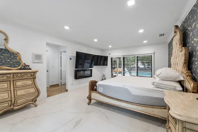 a bed room with a bed and a window