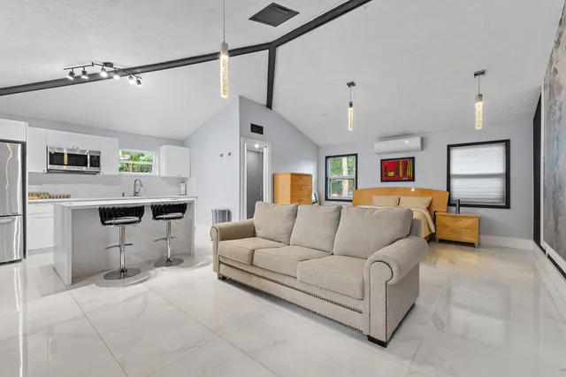 a view of a chairs and table in backyard of the house