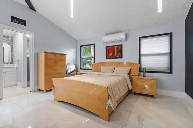 an aerial view of a house with yard