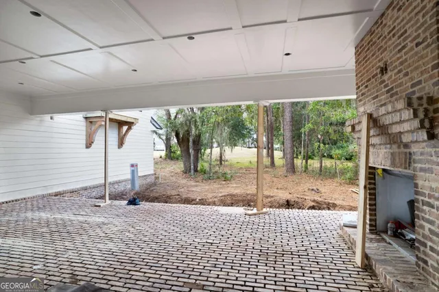 a view of a room with wooden floor and roof