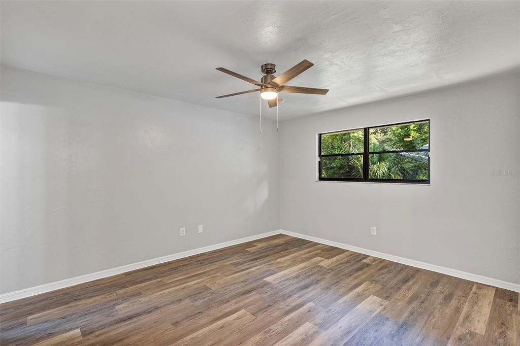 309 Southwest 77th Terrace Gainesville, FL 32607 - Photo 19 of 59 a view of empty room with wooden floor