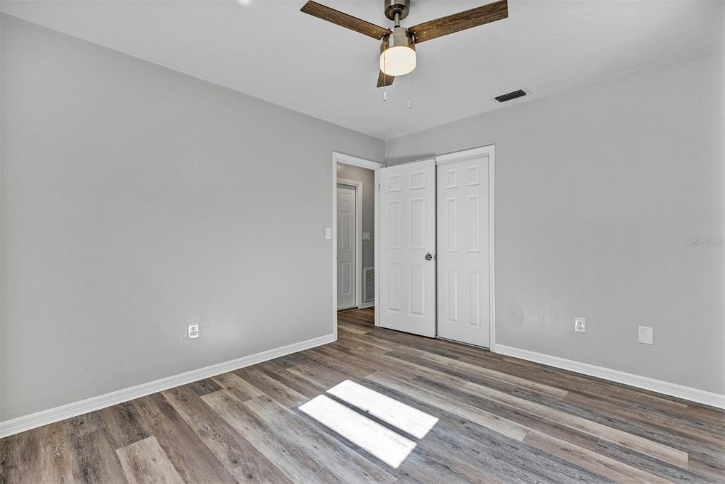 309 Southwest 77th Terrace Gainesville, FL 32607 - Photo 38 of 59 a view of a room with wooden floor and white walls