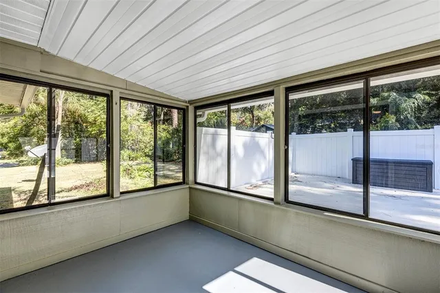 a view of a house with swimming pool and sitting area