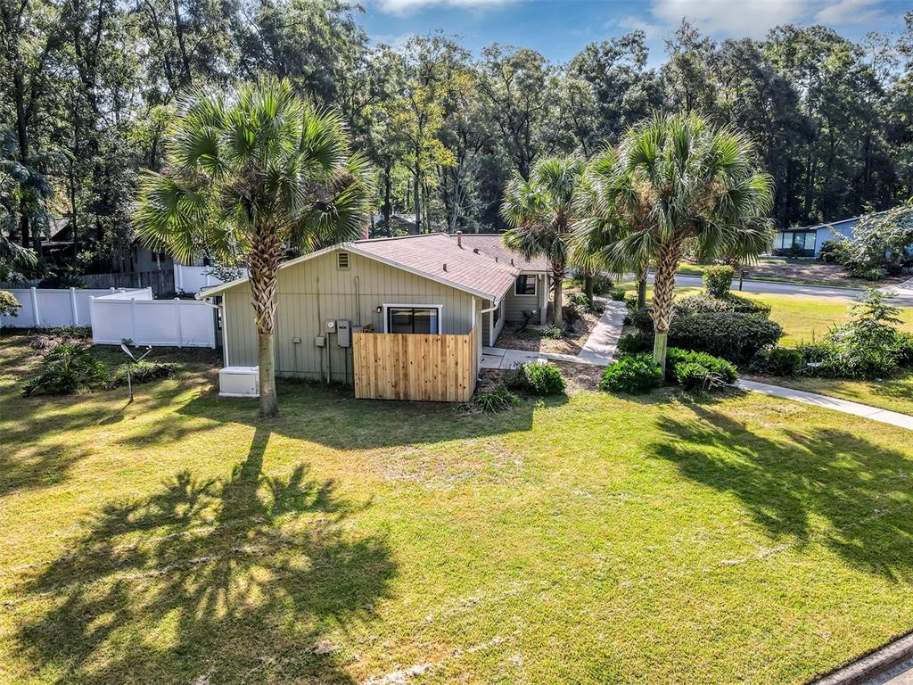 309 Southwest 77th Terrace Gainesville, FL 32607 - Photo 57 of 59 a view of a house with swimming pool and sitting area