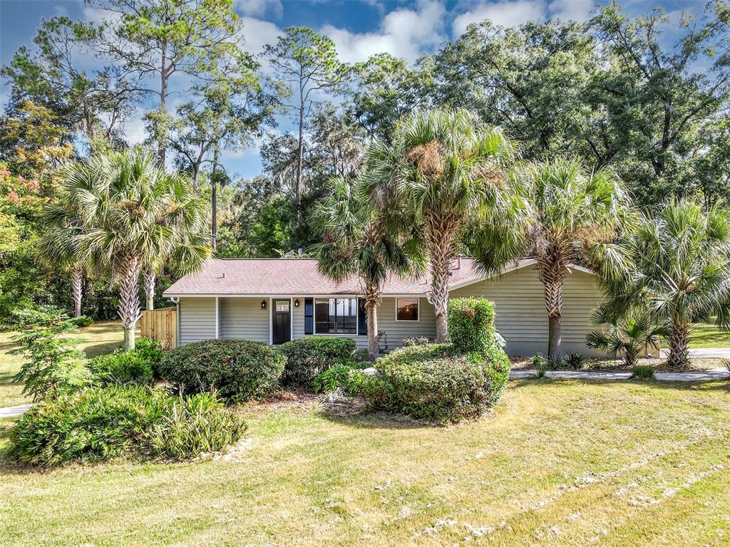 309 Southwest 77th Terrace Gainesville, FL 32607 - Photo 58 of 59 a view of a house with a yard