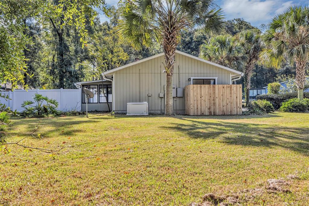 309 Southwest 77th Terrace Gainesville, FL 32607 - Photo 7 of 59 a house view with swimming pool in front of it