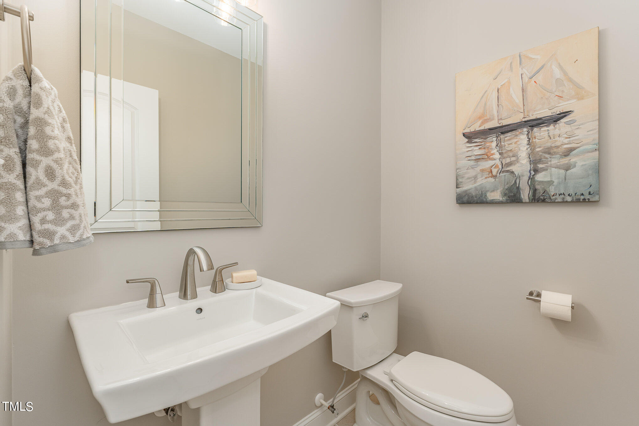 229 Robbins Road Durham, NC 27703 - Photo 14 of 26 a white toilet sitting next to a bathroom sink