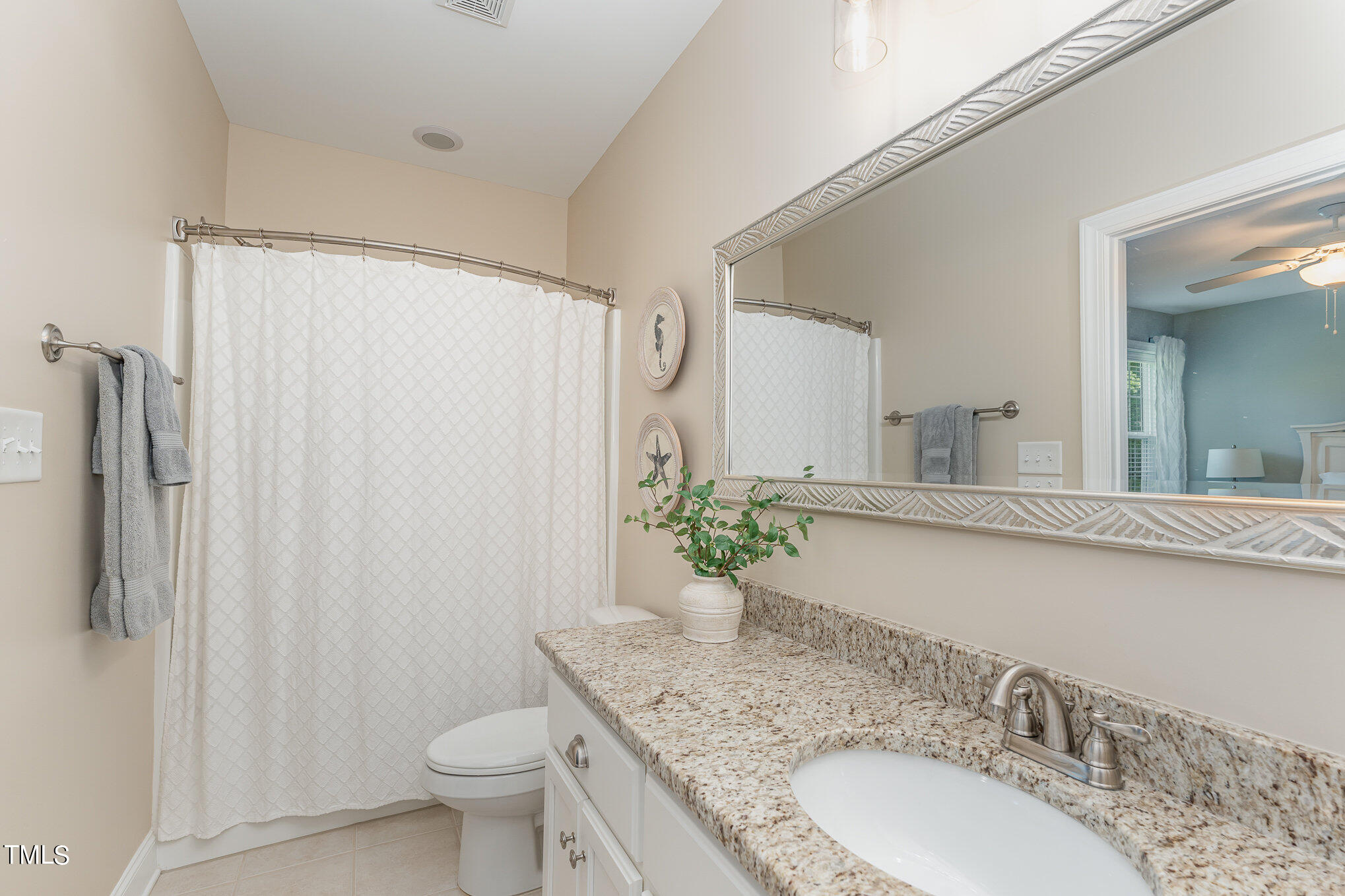 229 Robbins Road Durham, NC 27703 - Photo 17 of 26 a bathroom with a granite countertop sink toilet and shower