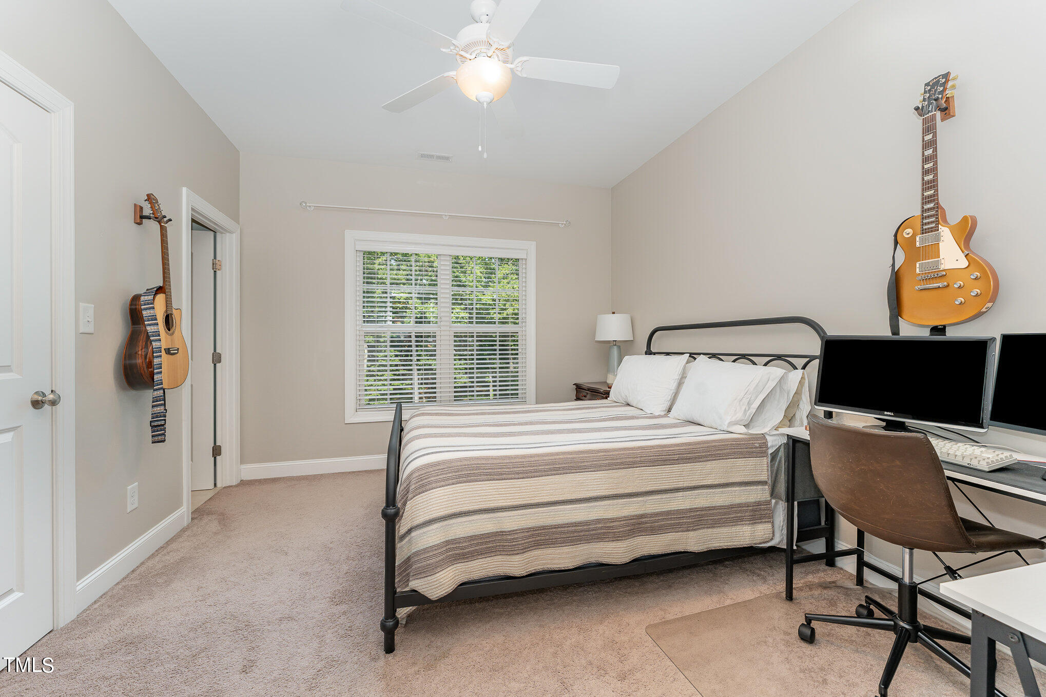 229 Robbins Road Durham, NC 27703 - Photo 20 of 26 a bedroom with a bed and a window