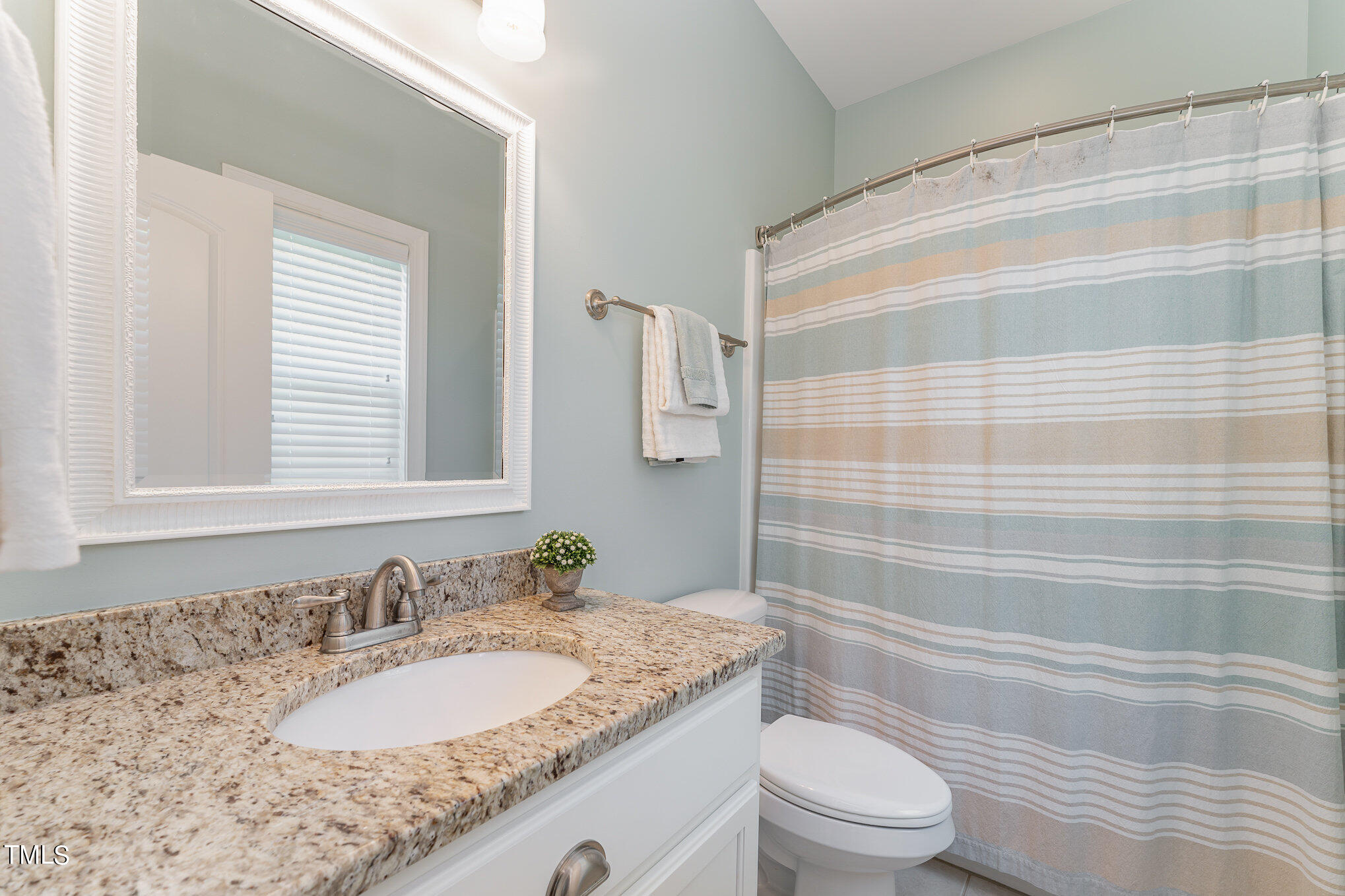 229 Robbins Road Durham, NC 27703 - Photo 21 of 26 a bathroom with a granite countertop sink toilet and shower