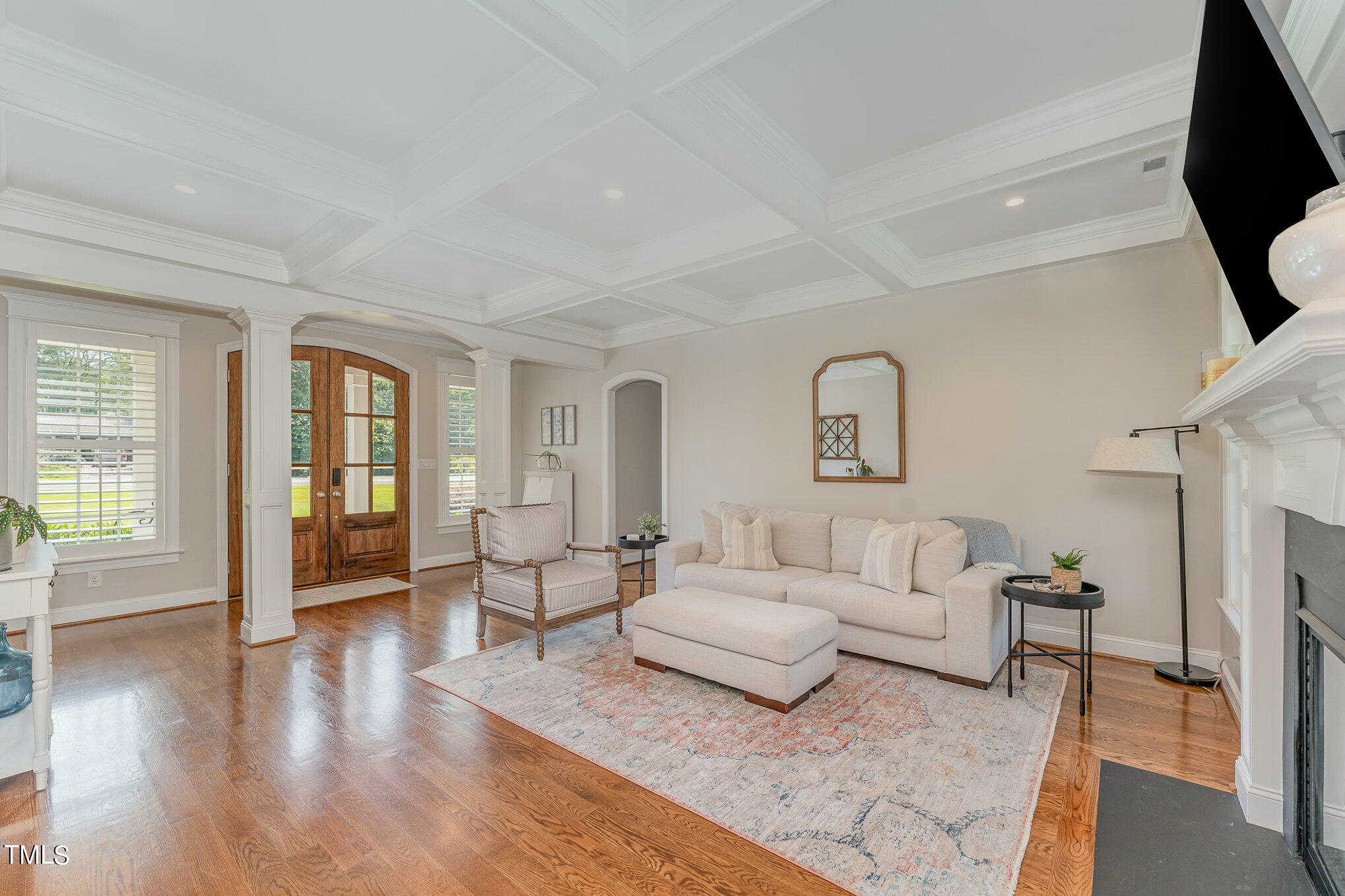 229 Robbins Road Durham, NC 27703 - Photo 3 of 26 a living room with furniture and a flat screen tv