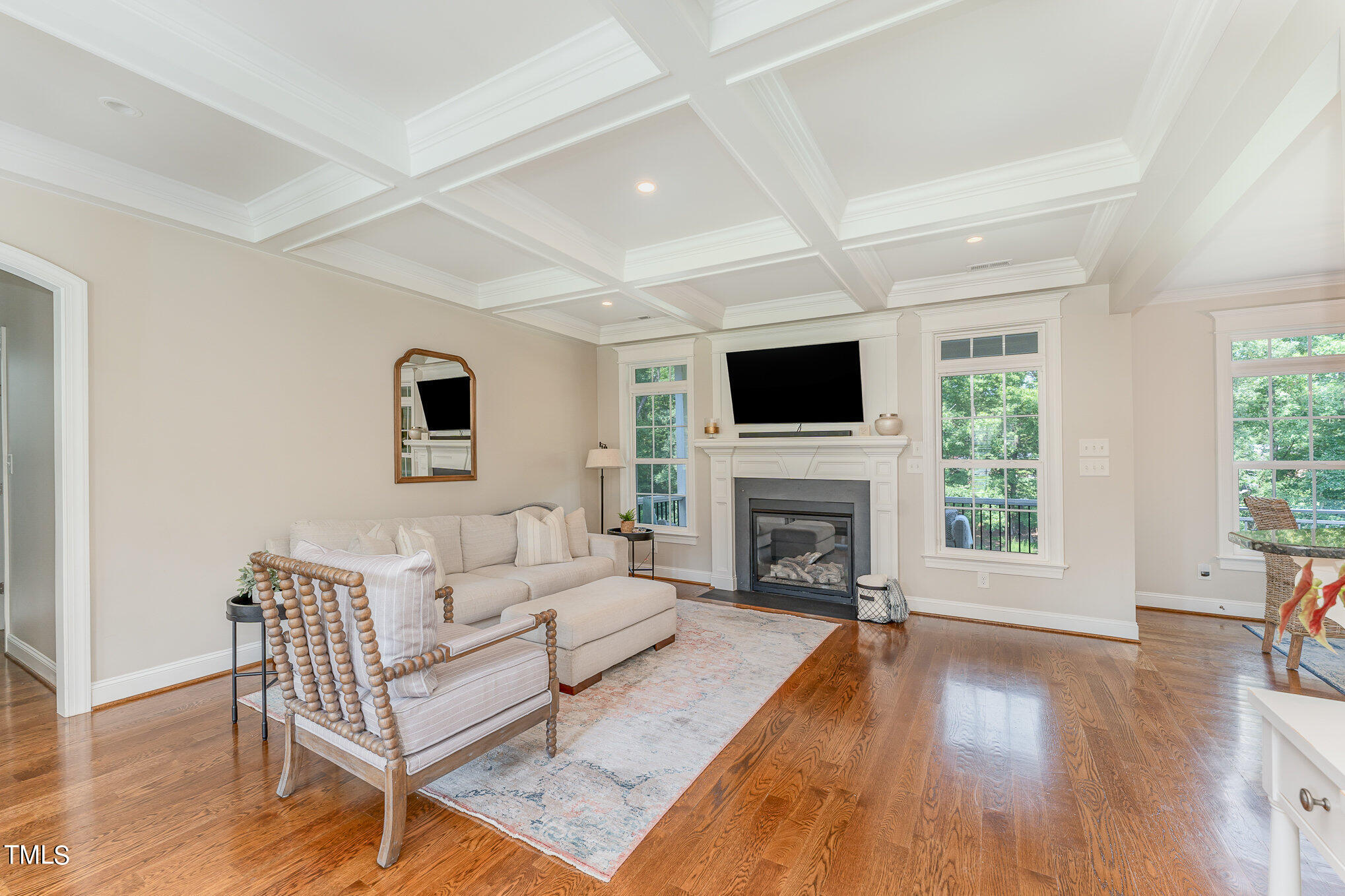 229 Robbins Road Durham, NC 27703 - Photo 4 of 26 a living room with furniture a fireplace and a flat screen tv