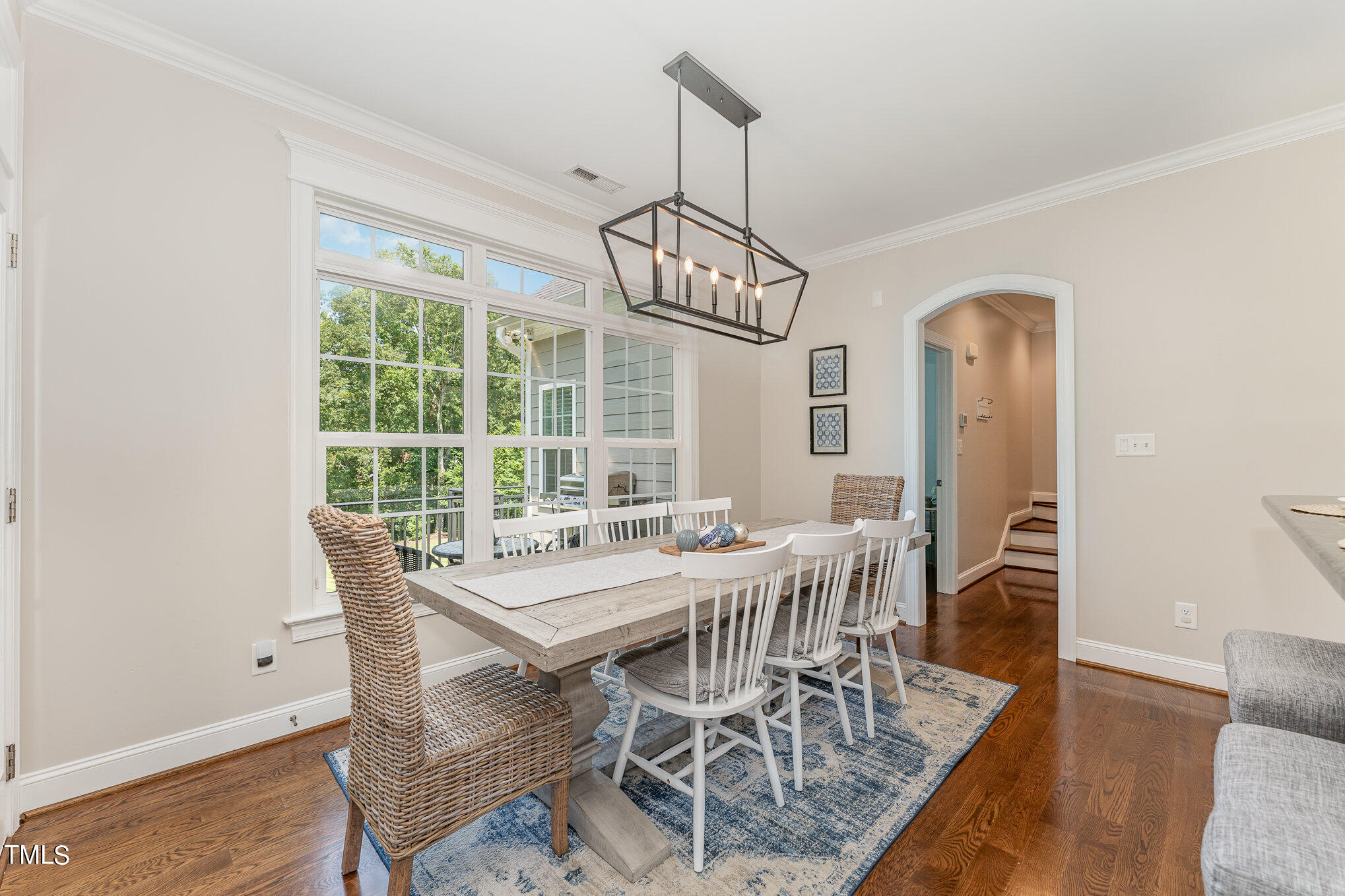 229 Robbins Road Durham, NC 27703 - Photo 5 of 26 a view of a dining room with furniture window and wooden floor