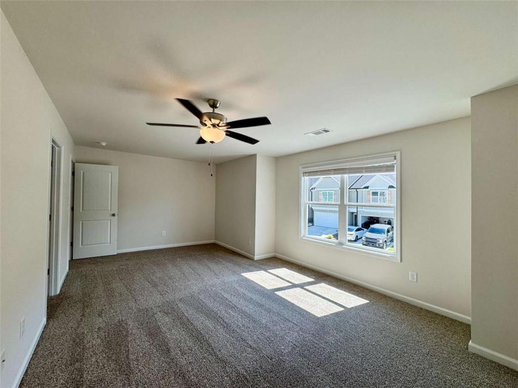 6346 Pine Ridge Point Lula, GA 30554 - Photo 17 of 26 a view of empty room with wooden floor