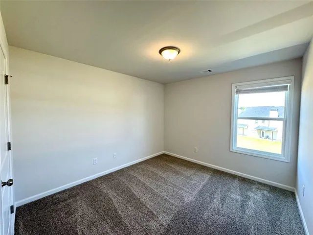 a bathroom with a granite countertop sink a toilet and bathtub