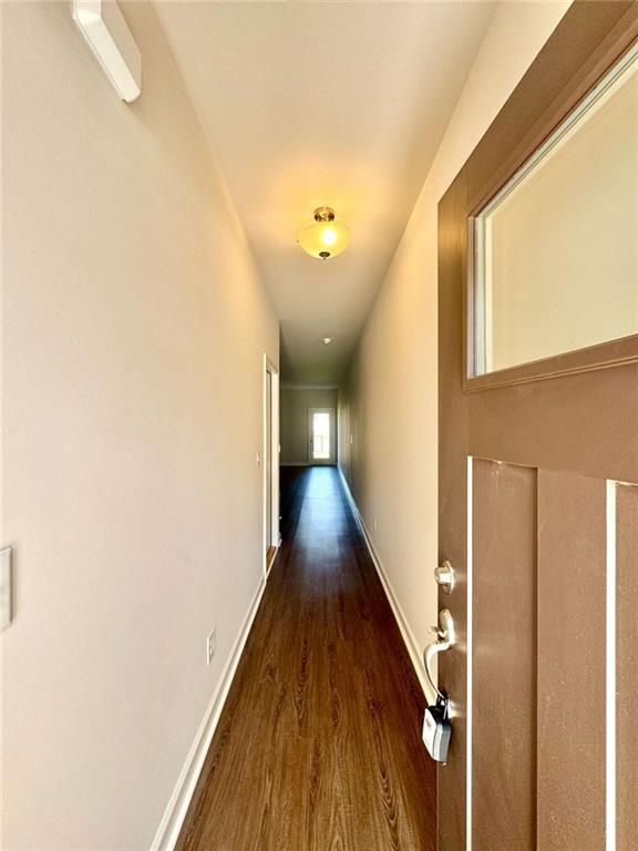 6346 Pine Ridge Point Lula, GA 30554 - Photo 8 of 26 a view of a hallway with wooden floor