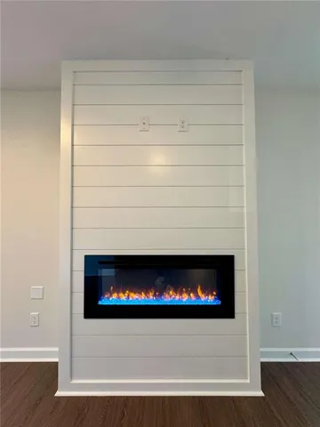 a kitchen with a sink stove top oven and refrigerator