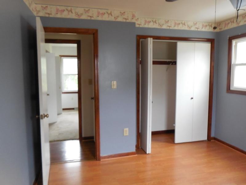 401 Rutherford Avenue Northwest Roanoke, VA 24016 - Photo 11 of 12 a view of a hallway with wooden floor and a bathroom