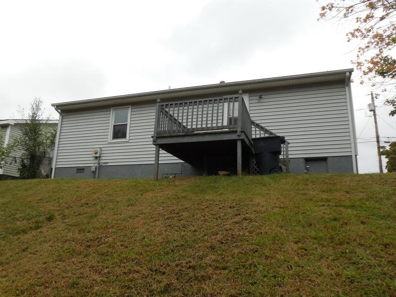 401 Rutherford Avenue Northwest Roanoke, VA 24016 - Photo 3 of 12 a front view of a house with a garden