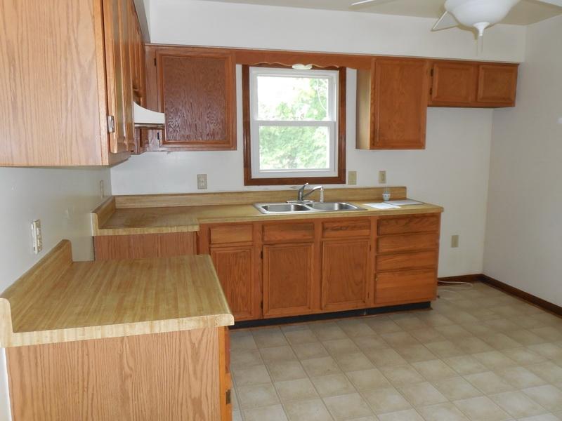 401 Rutherford Avenue Northwest Roanoke, VA 24016 - Photo 6 of 12 a kitchen that has a sink and a stove in it