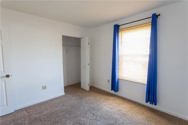 a view of an empty room and window