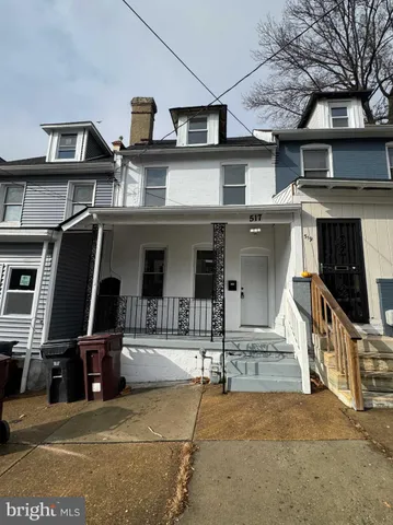 a front view of a house with garage