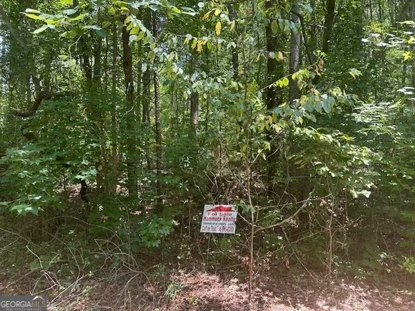 a sign that is sitting in a tree