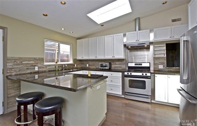 844 Rosal Way San Rafael, CA 94903 - Photo 1 of 1 a kitchen with stainless steel appliances granite countertop a sink a stove and a microwave