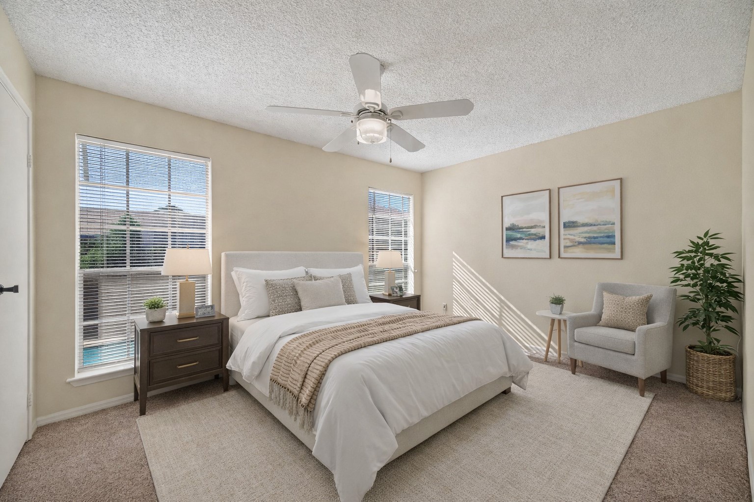 3100 Jeanetta Street, Unit 1004 Houston, TX 77063 - Photo 31 of 42 A second staged look at the primary suite highlights the incredible feature of having large windows that overlook the serene pool area. (Virtually staged)