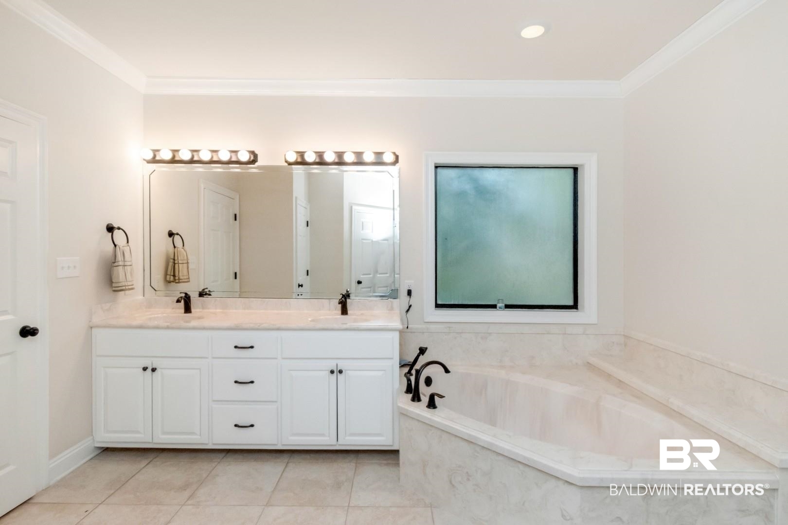 1360 Dykes Road North Mobile, AL 36608 - Photo 19 of 40 Full bath featuring a garden tub, double vanity, ornamental molding, light tile patterned floors, and recessed lighting
