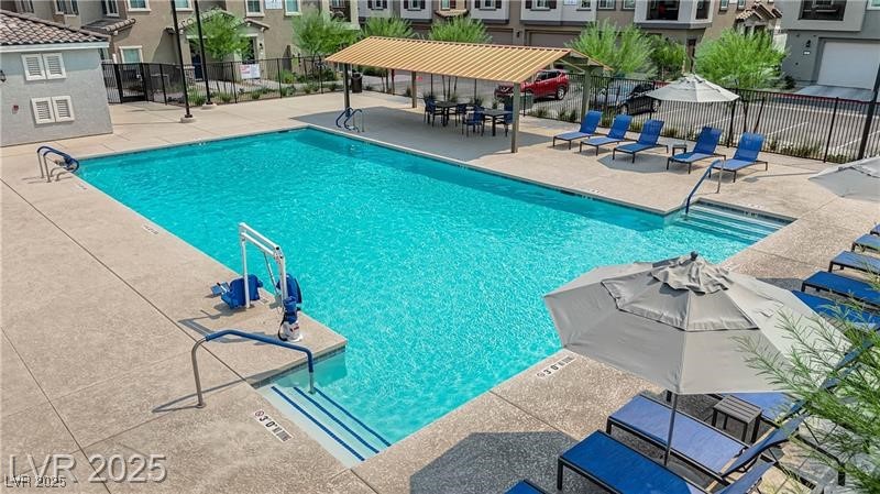 7308 North Decatur Boulevard, Unit 4 North Las Vegas, NV 89084 - Photo 32 of 34 Community pool with a patio and a residential view