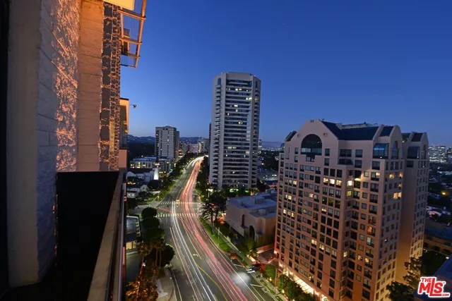 a view of a balcony with city view