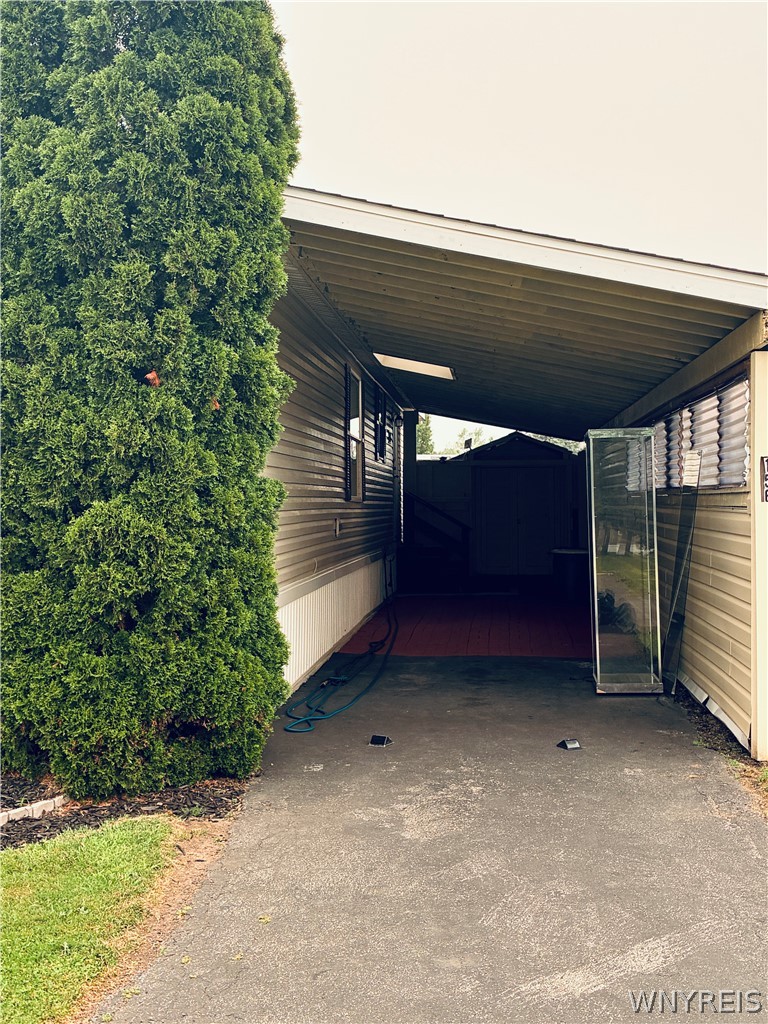 6035 South Transit Road Lockport Town, NY 14094 - Photo 4 of 32 SIDE LOAD CARPORT-RED BRICK PAVERS/BLK TOP