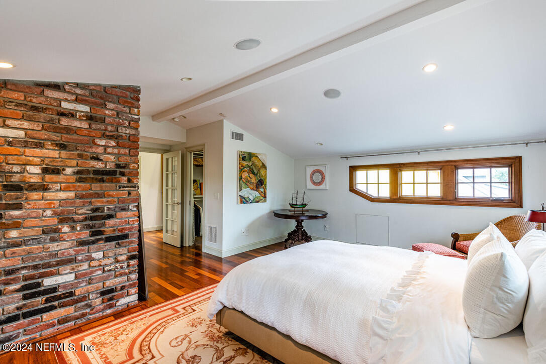 322 6th Street Atlantic Beach, FL 32233 - Photo 18 of 26 a bedroom with a bed and a flat screen tv