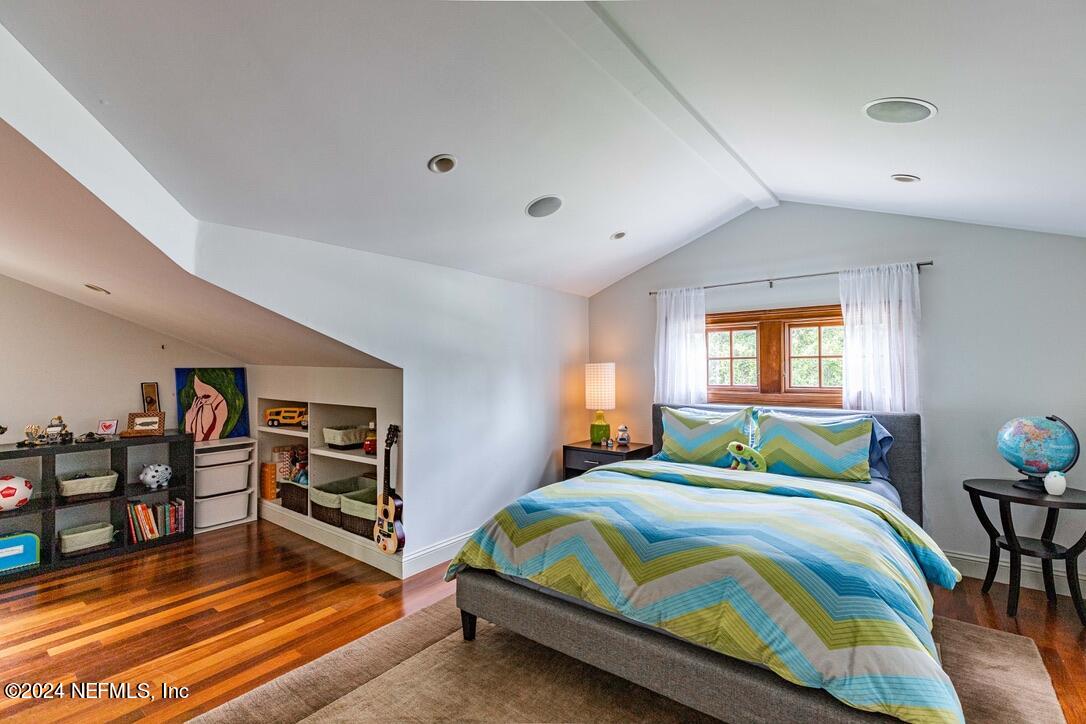 322 6th Street Atlantic Beach, FL 32233 - Photo 24 of 26 a bedroom with a bed and a bookshelf