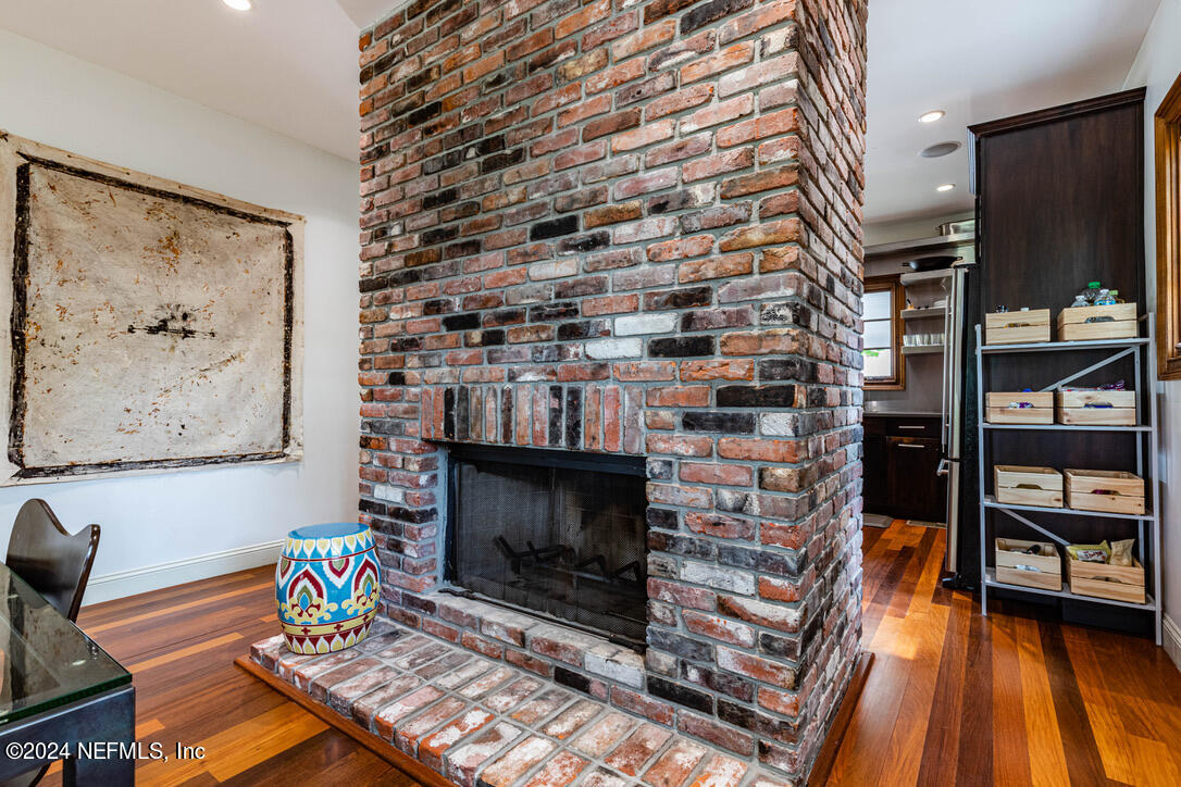 322 6th Street Atlantic Beach, FL 32233 - Photo 6 of 26 a living room with furniture a flat screen tv and a fireplace