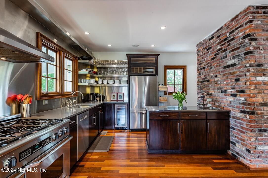 322 6th Street Atlantic Beach, FL 32233 - Photo 7 of 26 a kitchen with stainless steel appliances granite countertop a stove and a refrigerator