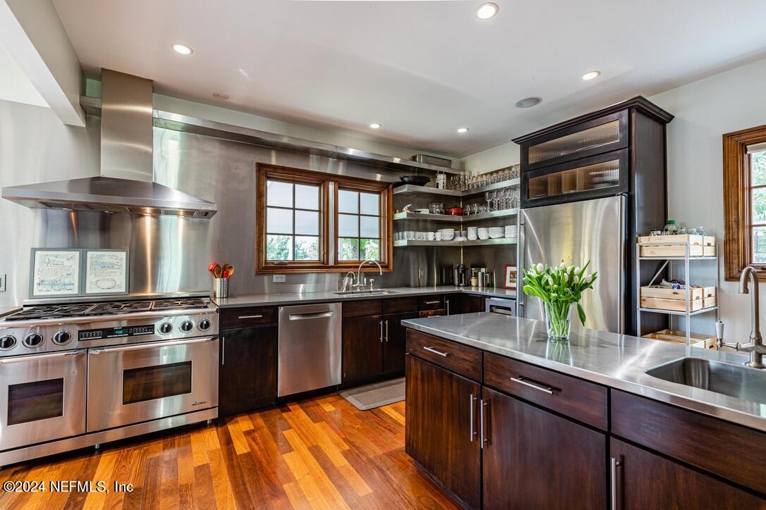 322 6th Street Atlantic Beach, FL 32233 - Photo 8 of 26 a kitchen with stainless steel appliances granite countertop a stove a sink and a refrigerator
