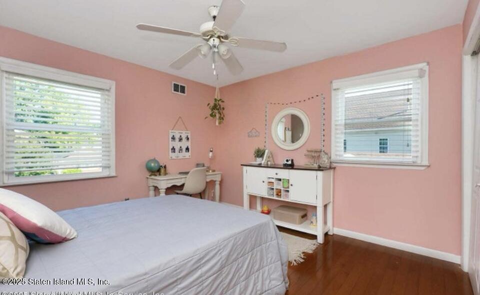 160 Rathbun Avenue Staten Island, NY 10312 - Photo 15 of 37 a bedroom with a bed and a window