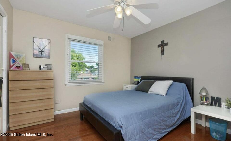 160 Rathbun Avenue Staten Island, NY 10312 - Photo 16 of 37 a bedroom with a bed and a dresser