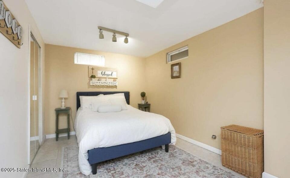 160 Rathbun Avenue Staten Island, NY 10312 - Photo 22 of 37 a bedroom with a bed and wooden floor