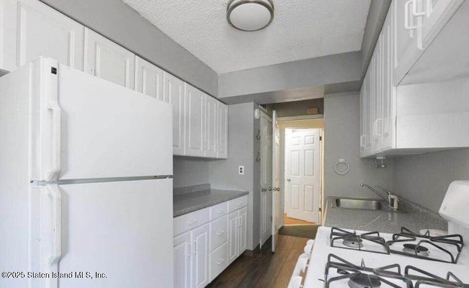 160 Rathbun Avenue Staten Island, NY 10312 - Photo 24 of 37 a kitchen with a refrigerator and a sink
