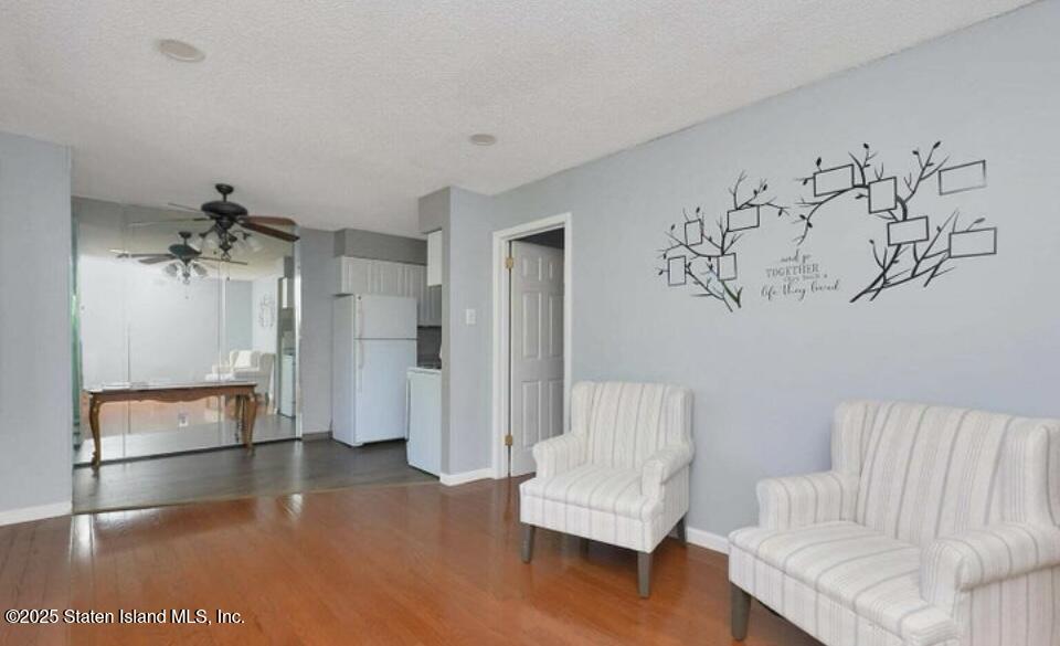 160 Rathbun Avenue Staten Island, NY 10312 - Photo 25 of 37 a living room with furniture and a rug