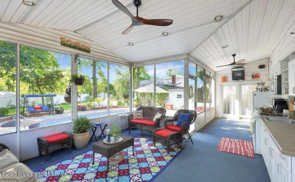 160 Rathbun Avenue Staten Island, NY 10312 - Photo 29 of 37 a living room with furniture and a floor to ceiling window